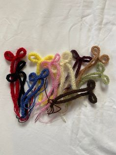 several crocheted hair ties laid out on a white sheet