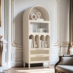 a white bookcase in the corner of a living room