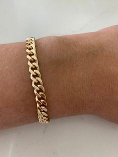 6MM Cuban Link Bracelet | Thick Cuban Bracelet | Statement Bracelet | Link Chain Bracelet | Shiny Bracelet HANDMADE- CUBAN LINK CHAIN BRACELET  ⁙ Materials: 18K Gold filled ⁙ Available Colors: Gold ⁙ Measurements: 7" in length, Links are 6MM wide HOW TO FIND YOUR PERFECT FIT ⁙  Your wrist size is the most important measurement for determining which length will work best for you. To measure, wrap a soft tape measure around your wrist keeping the tape measure perpendicular to the floor as you meas Luxury Modern Cuban Link Silver Chain Bracelet, Luxury Classic Cuban Link Bracelet With Complimentary Chain, Luxury Gold Cuban Link Bracelet With Polished Finish, Luxury Cuban Link Gold Bracelet, Luxury Gold Plated Classic Cuban Link Bracelet, Gold Bracelet Thick, Adjustable Cuban Link Gold Chain Bracelet As Gift, Adjustable Cuban Link Bracelet As Gift, Adjustable Cuban Link Bracelet Gift