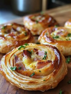 several small pastries on a wooden cutting board