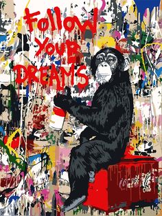 a monkey sitting on top of a red box with graffiti all over it's walls