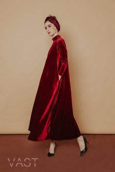 Following the brand's romantic lines and flowing silhouettes, this gown from VAST embodies the brand's elegance thanks to a maxi-style construction in a signature ruby red shade, presents the ultimate in opulence and drama, in a one-tone velvet look. Turtle neckline Long sleeves Flare silhouette Maxi length Loose fit Oversized winter dress A Line Long Dress, Baggy Dresses, Dresses For Fall, Low Back Dresses, Red Velvet Dress, Velvet Maxi Dress, Velvet Maxi, Velvet Dresses, Frill Dress