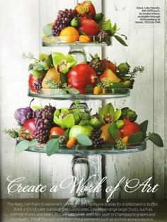 three tiered trays filled with fruit on top of each other