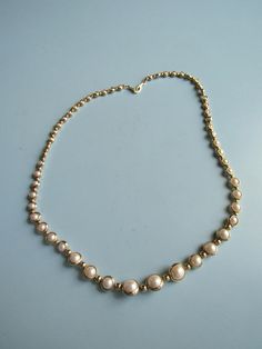 This vintage gold tone and faux pearl necklace is in good condition.  It is about 18 1/2 inches long and is ready to wear. Free domestic shipping. Real Pearl Necklace, Real Pearls, Faux Pearl Necklace, Beaded Necklaces, Vintage Gold, Faux Pearl, Pearl Necklace, Gold Tones, Ready To Wear