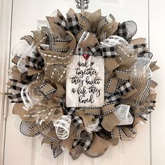 a wreath that says and together they build a life we love on the front door