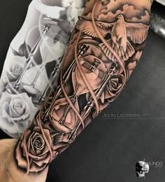 a man's arm with a clock and roses tattoo on the left side of his arm