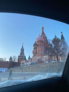 a view from inside a car looking at the red square and st basil cathedral in moscow