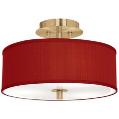 a light fixture with a red shade on it