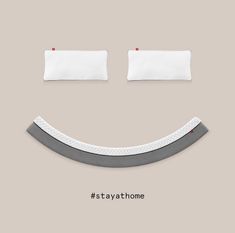 an advertisement with a smiley face and two pillows