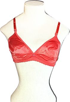 A vintage 1970s 80s bright burnt orange nylon soft cup unworn bra with a flower and jewel in the front.A size 34-36 A. A Pin Up or Rockabilly bra. A skimpy little bra from the Seventies Eighties.Nylon and lycra spandex stretch cups and band. Adjustable stretch straps.A single hook closure.27 1/2" around the band un stretched.Stretched 31 1/2"I believe this is better for a size 34. Excellent unworn condition with the tag. Thrift Clothes, Vintage Bra, 70s Clothing, Ace Frehley, 80s Outfit, Dazed And Confused, Hidden Beauty, Soft Cup Bra, The Seventies