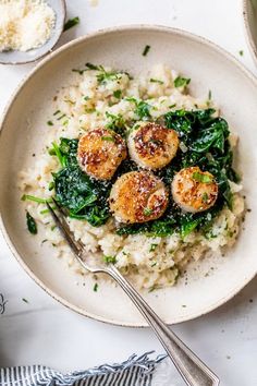 a white bowl filled with rice and seared scallops on top of it