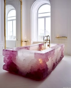 a bathtub in the middle of a white room