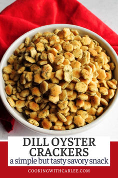 a white bowl filled with crackers on top of a red napkin