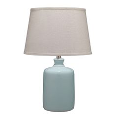 a light blue table lamp with a white shade