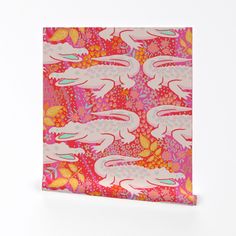 a pink and orange card with white rabbits on it's back, against a white background