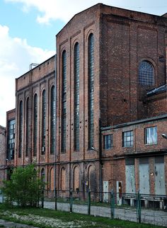 an old brick building with lots of windows