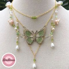 Capture the enchantment of nature with our Cute Fairy Green Butterfly Necklace. This whimsical piece is a delicate blend of charm and elegance, featuring a beautifully crafted green butterfly pendant. The intricate detailing adds a touch of magic to your neckline, making it a perfect accessory for those who appreciate the ethereal beauty of nature. Nature-inspired Butterfly Charm Necklaces, Whimsical Green Pendant Jewelry, Green Butterfly Charm Pendant Necklace, Bohemian Necklace With Butterfly Charm, Handmade Green Butterfly Necklace, Green Butterfly Charm Necklace, Elegant Green Butterfly Necklace As Gift, Elegant Green Butterfly Necklace For Gift, Elegant Green Butterfly Necklace Perfect For Gifts