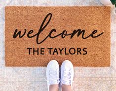 someone standing in front of a welcome mat with the words,'welcome the taylors '