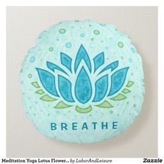 a blue and green round pillow with the words breathe on it's front side