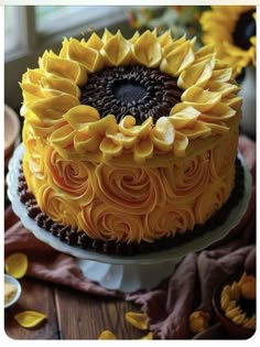 a sunflower cake with chocolate frosting on top