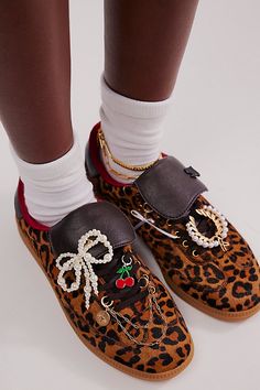 Wild, sporty, or both: These terrace-inspired sneakers from Jeffrey Campbell feature animal-printed, hair-on uppers with a fold-over tongue for a statement pair that are as comfy as they are cool. **Features:** Low-top style, hair-on uppers, T-toe design, fold-over tongue, contrast heel tab and lining, lace-up closure, contrast rubber sole **Why We | Avia Sneakers by Jeffrey Campbell at Free People in Brown, Size: US 6 Upcoming Fashion Trends, Cute Sundress, Metallic Sneakers, Silver Sneakers, Technology Fashion, Celebrity Lifestyle, Trending Sneakers, Brown Sneakers, Best Sneakers