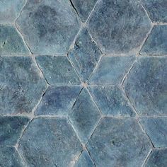 a blue tile floor with hexagonal shapes