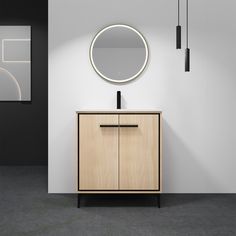 a bathroom vanity with a round mirror on the wall above it and a wooden cabinet below