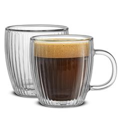 two clear mugs with brown liquid in them