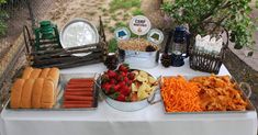 a table topped with lots of food and snacks