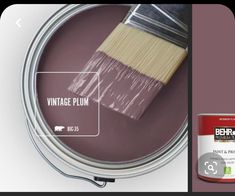 a paint can with a brush in it next to an image of a purple tin