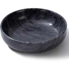 a black bowl sitting on top of a white table