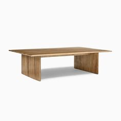 a wooden table on a white background with no one around it or the table is empty