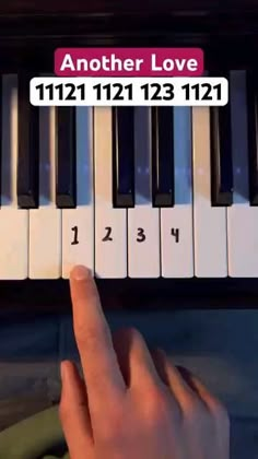 someone is playing the piano with their finger and another hand on top of it that says, another love