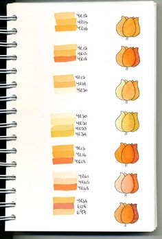 an open notebook with oranges and yellows on the pages, along with other color swatches