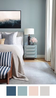 a bed room with a neatly made bed next to a painting on the wall and a dresser