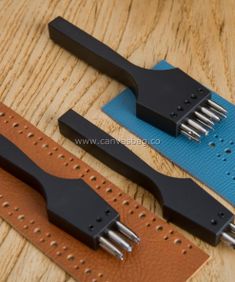 two different types of watch straps on a wooden table