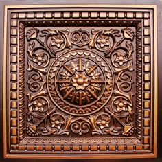 an intricately designed ceiling tile in the shape of a clock