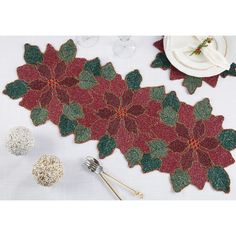 the table is decorated with poinsettias and silverware