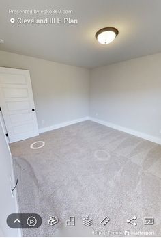 an empty room with carpet and white walls