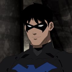 an animated image of a man with black hair wearing a batman mask and looking at the camera