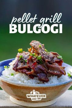 a bowl filled with rice and meat on top of a wooden table next to the words pellet grill bulgogi