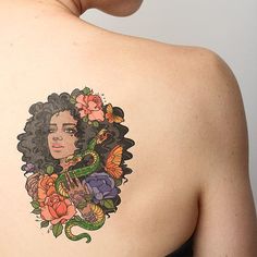 a woman with a tattoo on her back