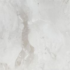 a white marble textured background with some black dots