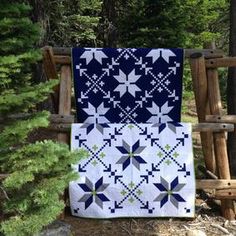 the cover of northern lights quilt pattern book, featuring an image of a blue and white quilt