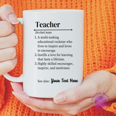 a woman holding a coffee mug with the words teacher on it