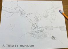 a child's drawing is shown on top of a piece of paper that says, a thrifty mom com