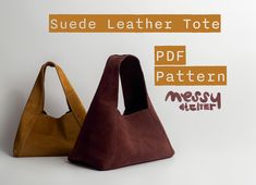 two suede leather tote bags sitting next to each other on a white background