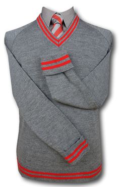 A top quality mid grey 'V' neck jersey with fold back cuffs. Red trim at the neck line, cuffs and welt. Available in sizes from 36" to 48". 100% man made fibres. Fully machine washable. Medium weight and will keep you nice and warm. British made. A range of matching accessories are also available. Fitted Gray Sweater With Ribbed Cuffs, Fitted Red Tops With Ribbed Cuffs, Grey School Shorts, Grey Uniform, Woolen Socks, School Shorts, Matching Accessories, Red And Grey, Neck Line