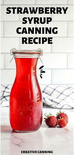 strawberry syrup in a glass jar with strawberries next to it