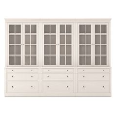 a white cabinet with glass doors and drawers on the bottom, in front of a white background